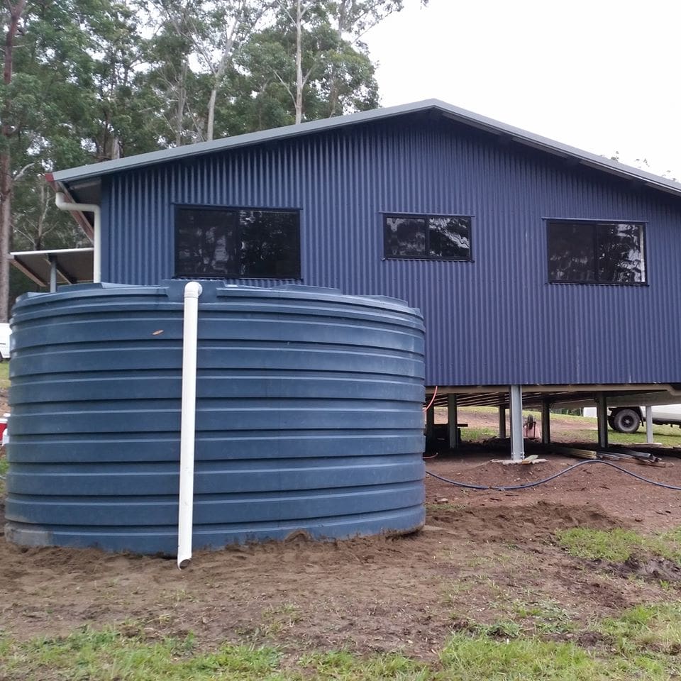 Tank at side of a home