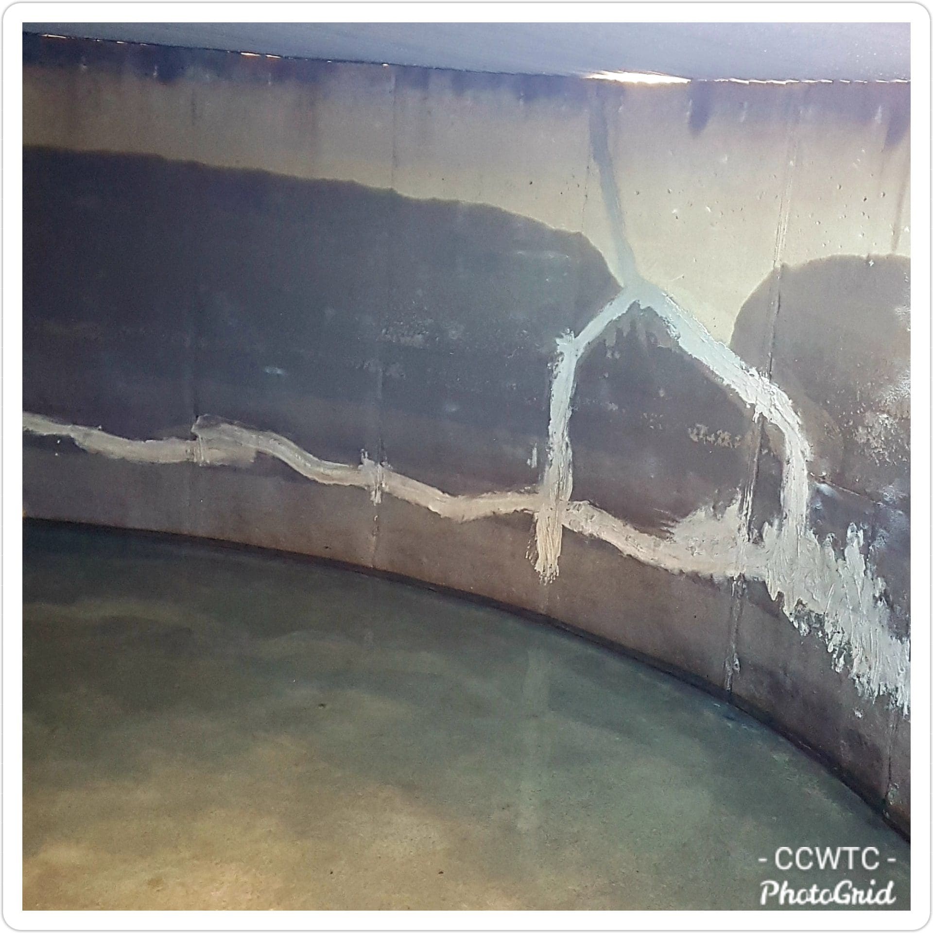 Concrete tank interior showing repaired cracks